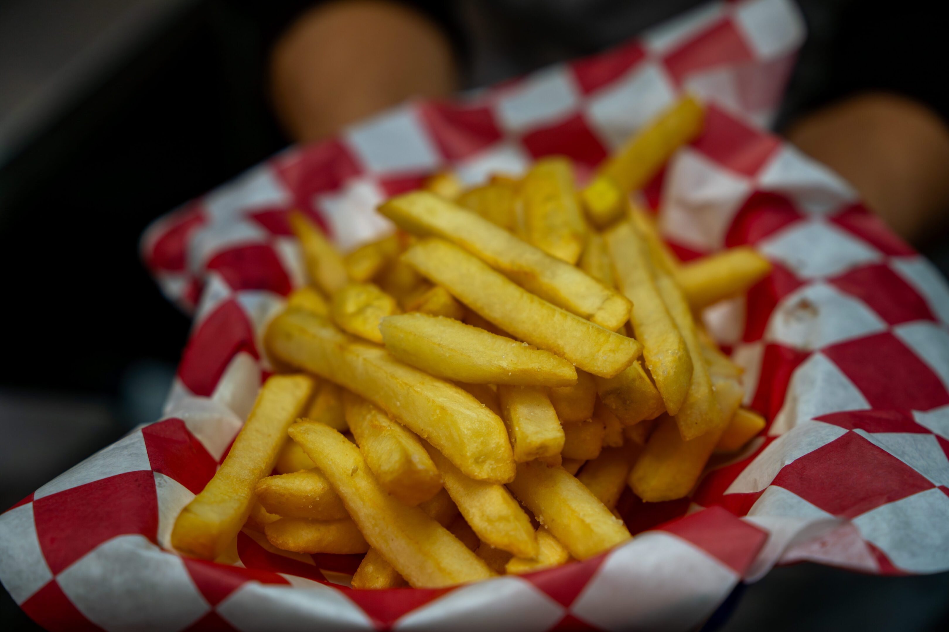 A basket of golden, crispy French fries.
