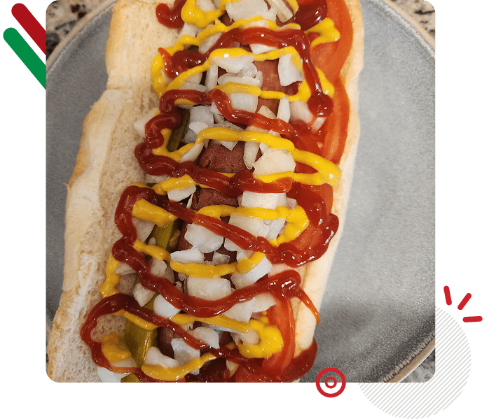 Flatbread topped with diced chicken, ketchup, and mustard.